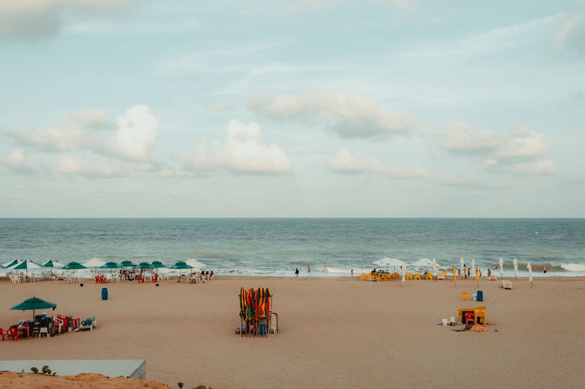 Peaceful beach scene with umbrellas and ocean view in Natal, Brazil.