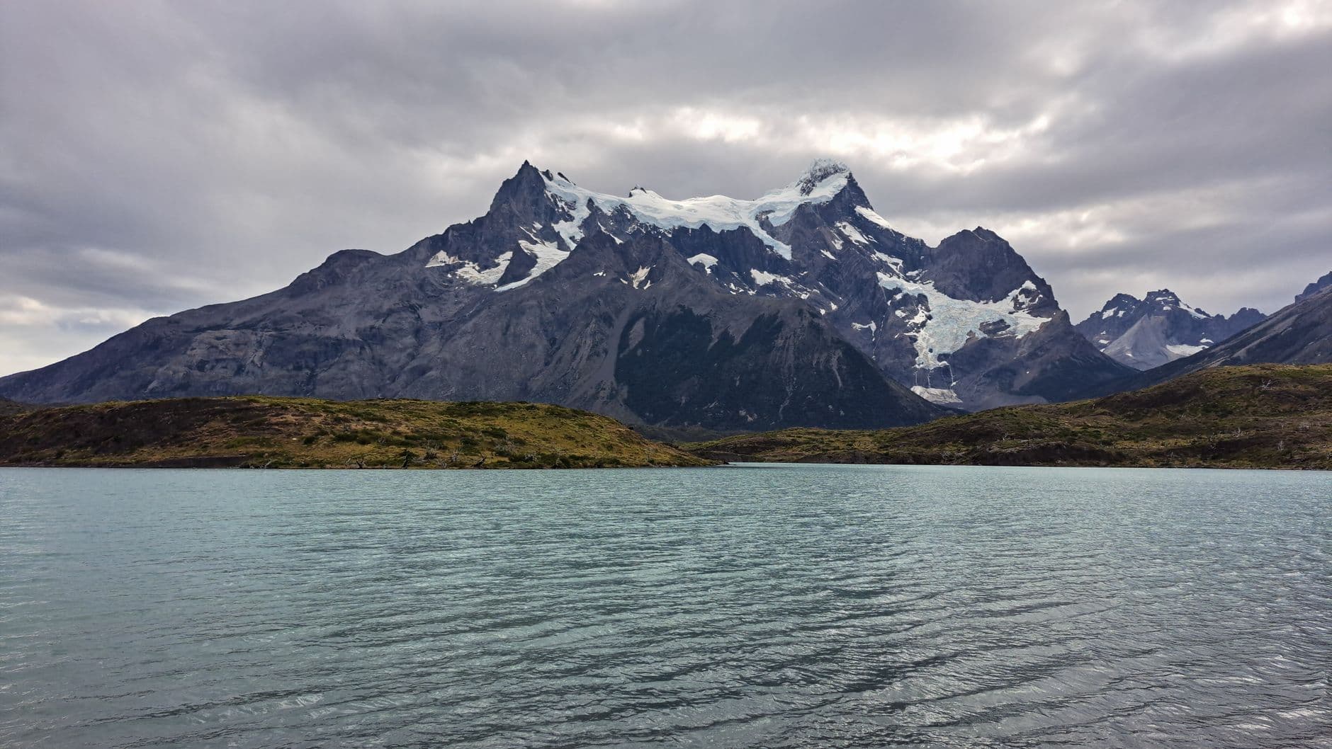 Stunning view of Torres del Paine mountains with glacial water in Patagonia, Chile.