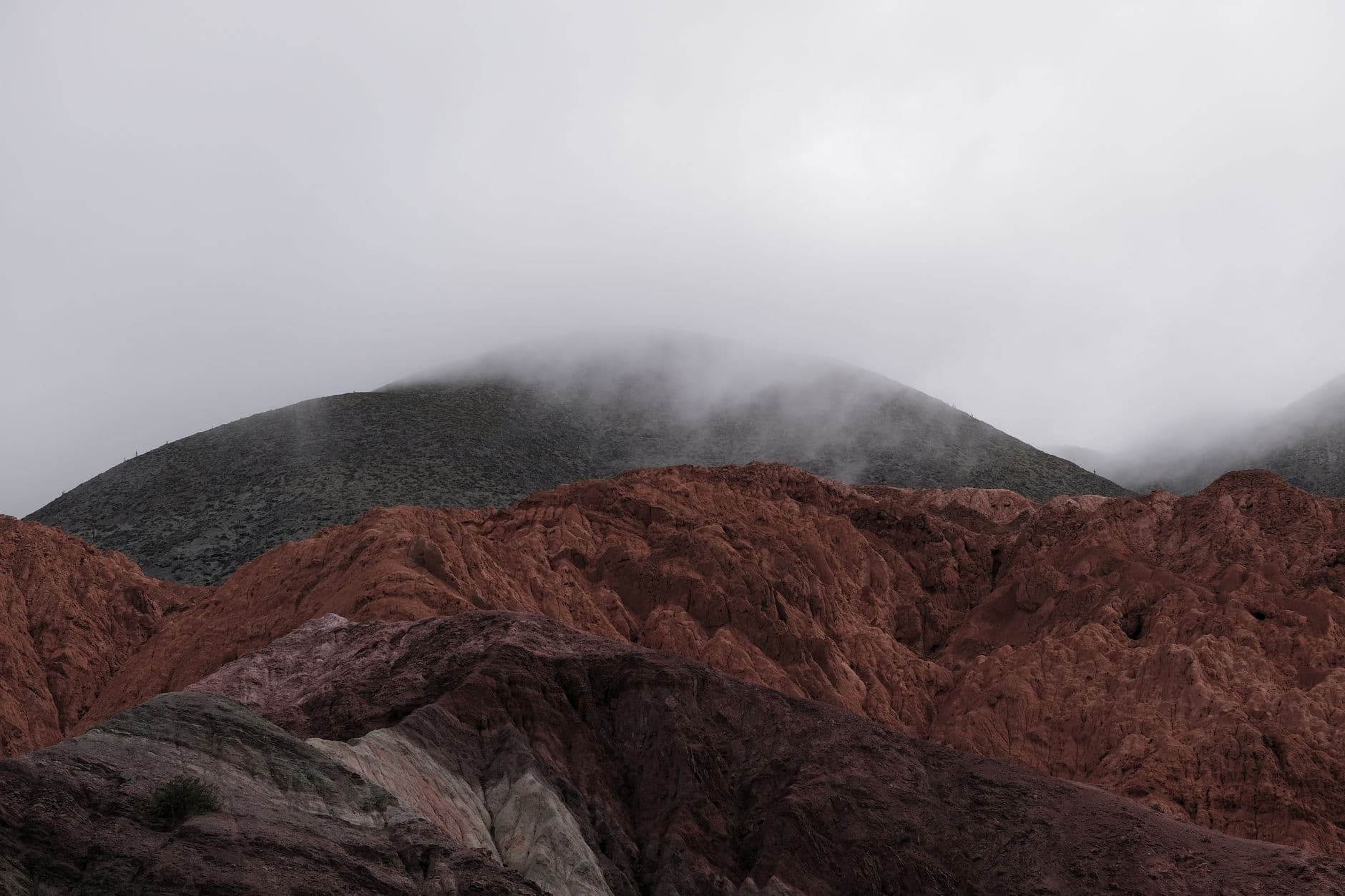 Stunning view of the colorful misty mountains in Purmamarca, Argentina.