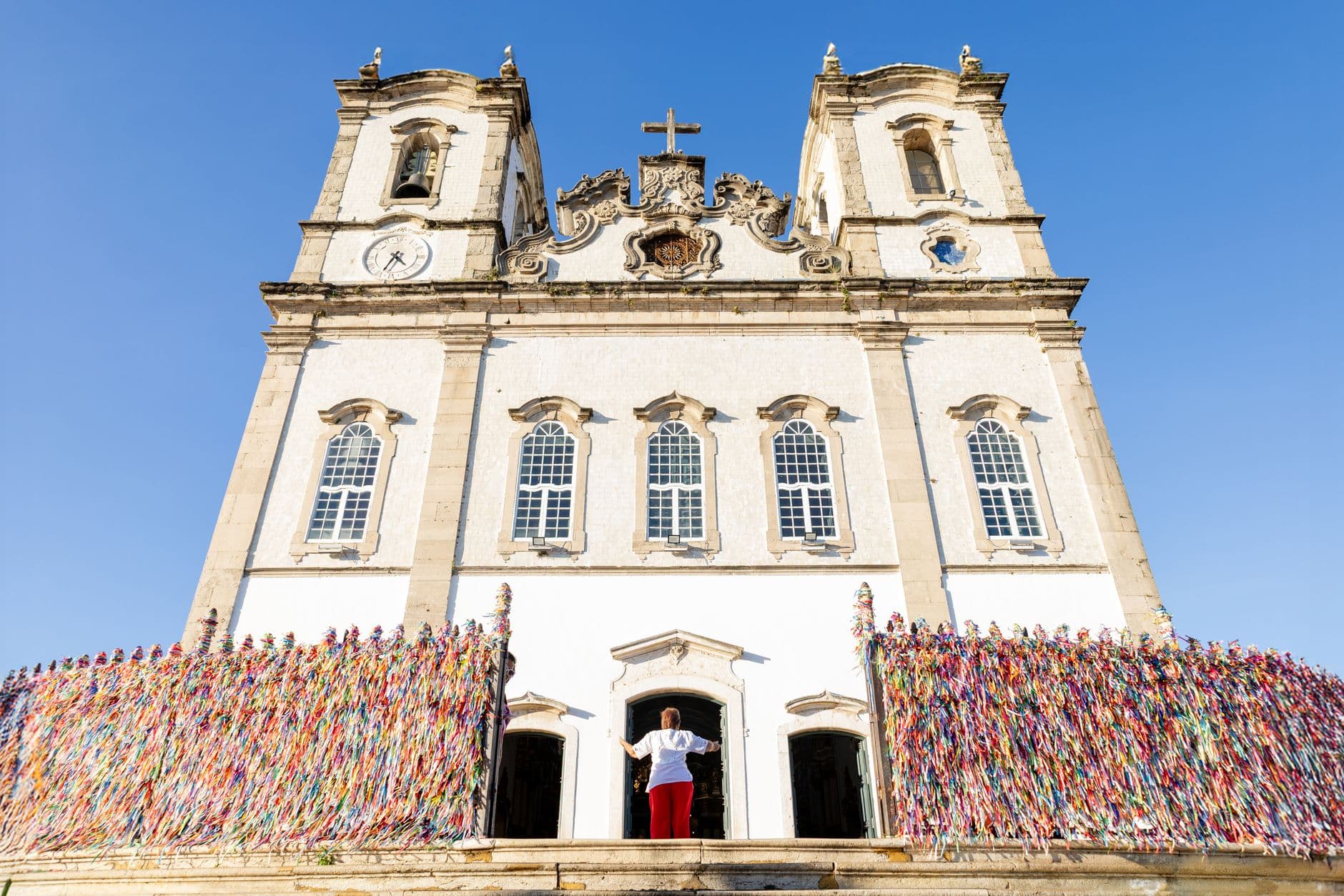 Front view of Bonfim Church with colorful ribbons in Salvador, Brazil.