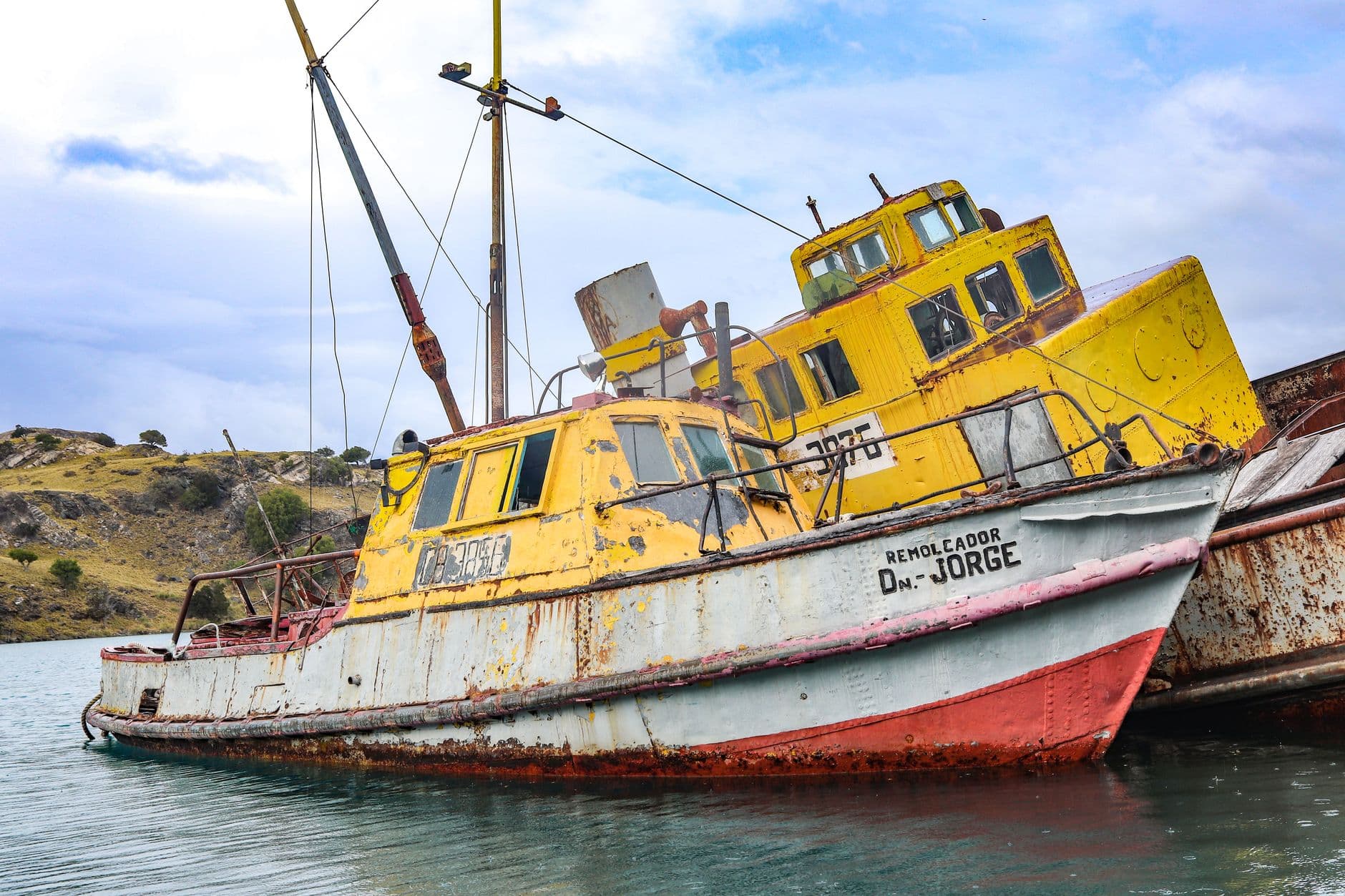 Old and rusty fishing boats in Chile Chico, Aysén, Chile offer a glimpse into maritime history.